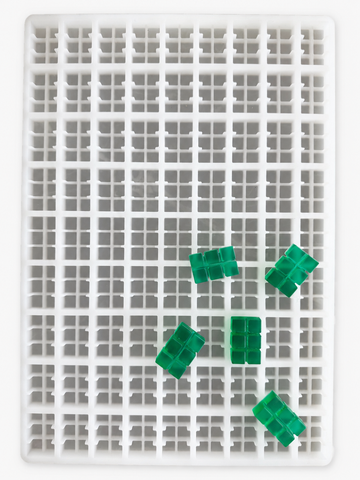 9.35mL 6-piece brick breaker gummy mold with 81 cavities and emerald green segmented brick gummies